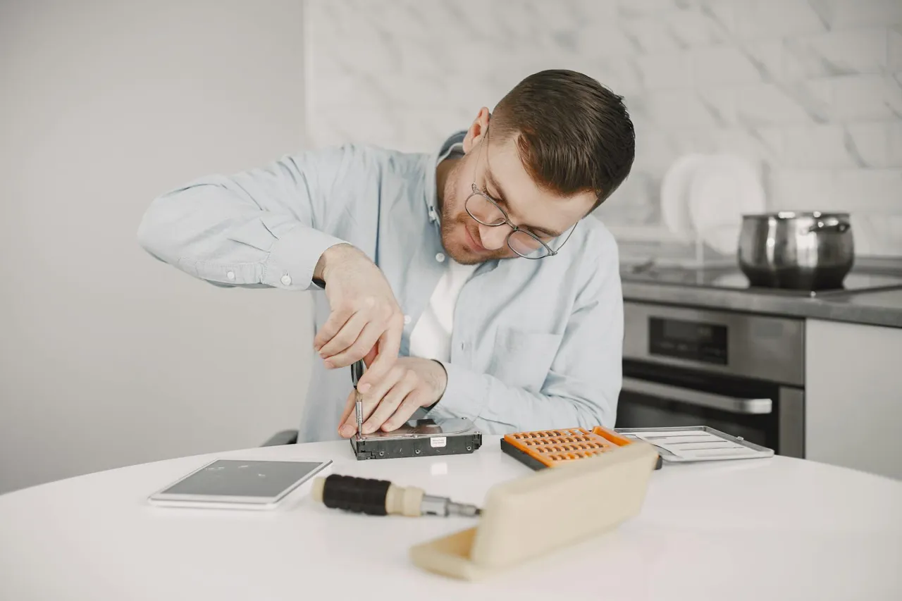 Technician repairing a household appliance