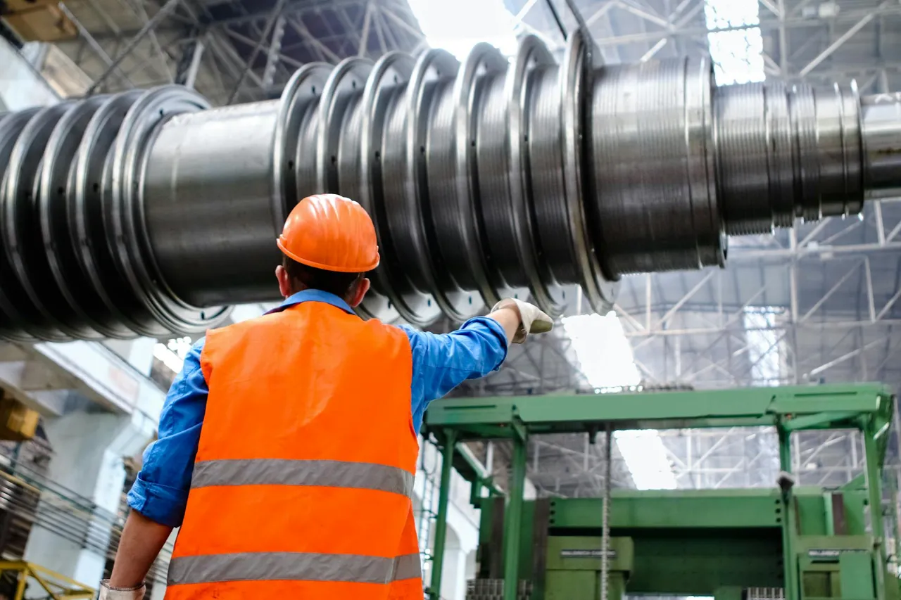 HVAC technician inspecting ductwork in a commercial building